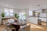 Kitchen featuring white cabinetry, quartz-surface countertops, stone-patterned backsplash, and natural wood-finish open shelving
