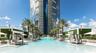 Resort-style swimming pool featuring integrated cabanas, palm tree landscaping, and vertical garden walls
