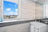 Remodeled guest bathroom with Glass framed Shower + Bathtub
