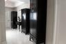 Polished white tile flooring, recessed ceiling lighting, and neutral wall tones