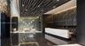 Lobby area featuring a geometric slat ceiling, polished dark tile flooring, a large stone-surface reception desk, a textured feature wall, and integra