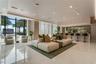 Open-concept interior featuring floor-to-ceiling windows, polished stone flooring, recessed ceiling lighting, and a built-in bar area with stone count