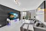 Large-format tile accent wall, polished tile flooring, and floor-to-ceiling glass door