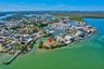 Waterfront parcel featuring direct canal access, a coastal location, and mature tropical vegetation