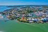 Waterfront parcel featuring direct canal access, expansive shoreline, and mature tropical vegetation