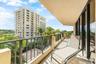 Private balcony with metal railings, tiled flooring, and sliding glass door access