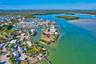 Waterfront parcel situated on a peninsula featuring direct coastal access, extensive shoreline, and established native vegetation