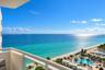 Private balcony featuring a white metal railing and expansive ocean backdrop