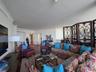Spacious interior featuring hardwood flooring, intricate crown molding, and recessed lighting