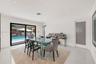 Interior space featuring white stone-finish flooring, recessed lighting, and a frosted glass-panel door