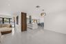 Open-concept kitchen featuring a center island, modern flat-panel cabinetry, stainless steel range hood, recessed lighting, and large-format porcelain