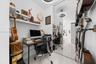 Polished tile flooring, built-in wall-mounted shelving, floor-to-ceiling mirror paneling, and circular LED overhead lighting