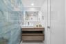 Open-concept floor plan with polished tile flooring and recessed ceiling lighting