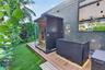 Outdoor space featuring a composite deck, glass-enclosed sauna, and a built-in plunge tub with under-mount lighting