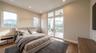 Wood-finish flooring, recessed lighting, double glass doors with transom windows, and mountain scenery