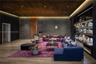 Wood-finish flooring, dark stone wall cladding, wood-paneled ceiling with recessed lighting, integrated cove lighting, and built-in wall shelving with