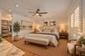 Wood-finish flooring, recessed lighting, ceiling fan, interior plantation shutters, and a built-in open closet system