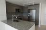 Kitchen featuring stone countertops, flat-panel cabinetry, stainless steel appliances, a single-basin undermount sink, and track lighting