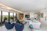 Living Room is bright and spacious and offers a magnificent Bay and Landscaping view