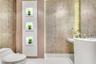Textured stone-finish wall coverings, vertical built-in recessed shelving with integrated lighting, wood-finish paneling, white pedestal sink, and pol