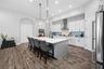 Kitchen has a 9 x 5 foot Quartz Island
