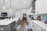 Kitchen with Quartz Counters and 9 foot Island