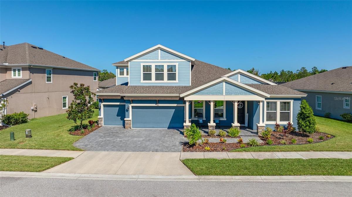 Gated Woodlands with 3 car garage