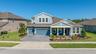Gated Woodlands with 3 car garage