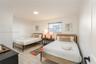 Neutral-toned ceramic tile flooring, flush-mount lighting fixture, and horizontal blind window treatment