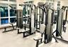 Fitness center featuring large-scale floor-to-ceiling mirrors and expansive multi-pane windows