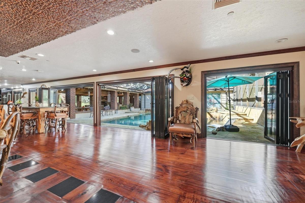 dining-living areas to pool view