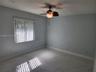 Interior room featuring large-format tile flooring, recessed lighting, and a ceiling fan with integrated light fixture