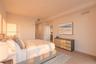Neutral-toned interior featuring wood-finish flooring, recessed lighting, and crisp wall finishes