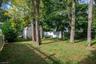 wooded lot behind shed