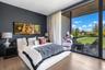 Floor-to-ceiling glass sliding doors, wood-finish flooring, dark-toned accent wall, and a recessed ceiling with wood-plank paneling