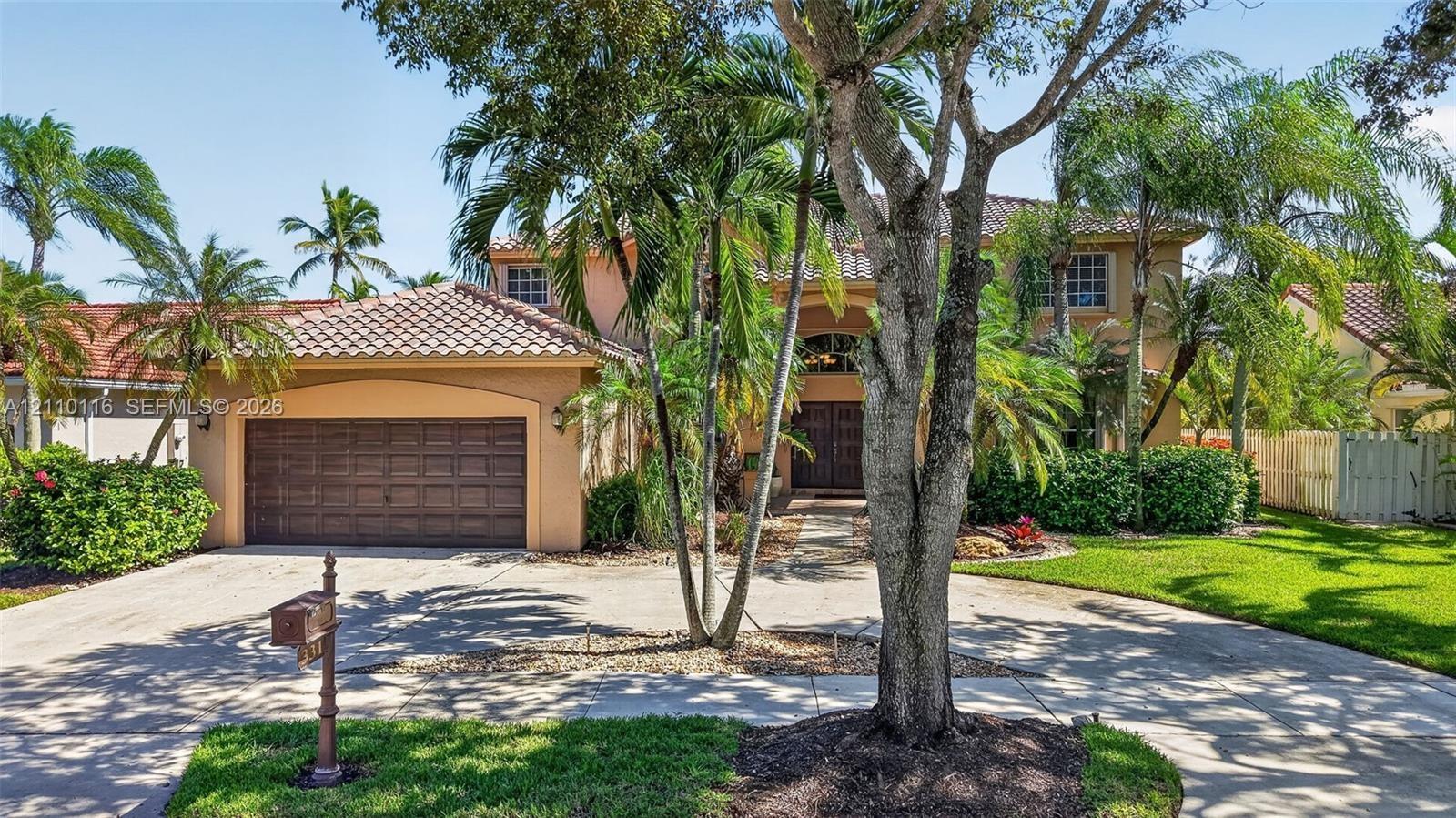 BRAND NEW tile roof, arched entryway, and 2-car garage circular driveway