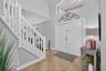 Foyer featuring high ceilings, double entry doors