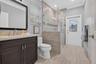 Cabana Bathroom leading to pool & patio; shower enclosure with glass walls