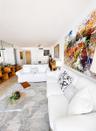 Neutral tile flooring, expansive mirrored wall panels, and white solid-core interior doors