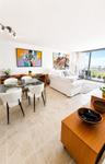 Open-concept room featuring light-toned tile flooring, adjustable multi-head track lighting, floor-to-ceiling glass sliding doors, and a private balco