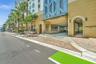 Street-level access to a multi-story building featuring a covered drive-through entrance