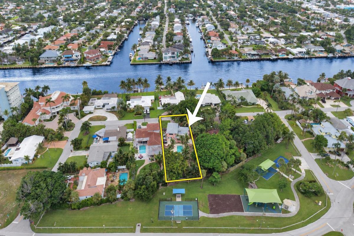 Aerial view showing the full lot depth, nearby Intracoastal and neighboring park.