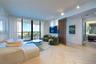 Herringbone-patterned wood-finish flooring, floor-to-ceiling glass sliding doors, slatted wood partition, and adjustable track lighting