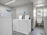 Designated laundry area featuring dual commercial grade washers on each floor.