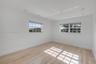 Interior space featuring wood-finish flooring, recessed ceiling lighting, and multi-pane windows