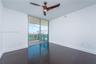 Dark wood-finish flooring, floor-to-ceiling glass sliding door, private balcony, and three-blade ceiling fan with integrated lighting