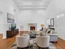 Virtually Staged. Awesome living room with high ceilings and exposed beams. Great home for rent in Coconut Grove in Miami, FL. Enjoy large fenced yard