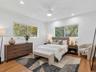 VIRTUALLY STAGED. Sunny and private back bedroom overlooking gated yard with double closet. House for rent in Coconut Grove.