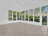 Sunny and private florida room surrounded by nature. Great home for rent in Coconut Grove in Miami, FL. Enjoy large fenced yard, updated home in the N