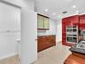 Stylish Poggenpohl kitchen with stainless steel appliances in home for rent in Coconut Grove in Miami, FL. Also showing bath. Updated rental in Natoma